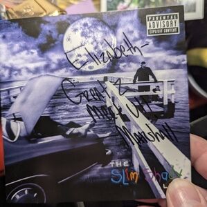 Two Hand signed personalized signed CD booklets from Eminem. No COA.